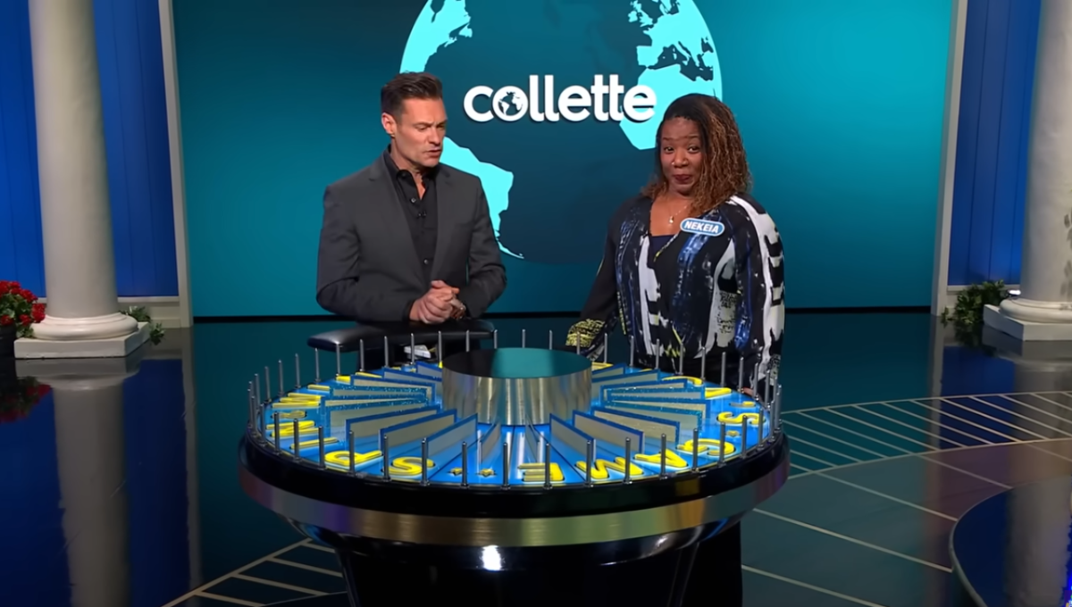 Show host Ryan Seacrest and contestant Nekeia Borders in a 'Wheel of Fortune' episode, Photo Credit: Wheel Of Fortune/Youtube