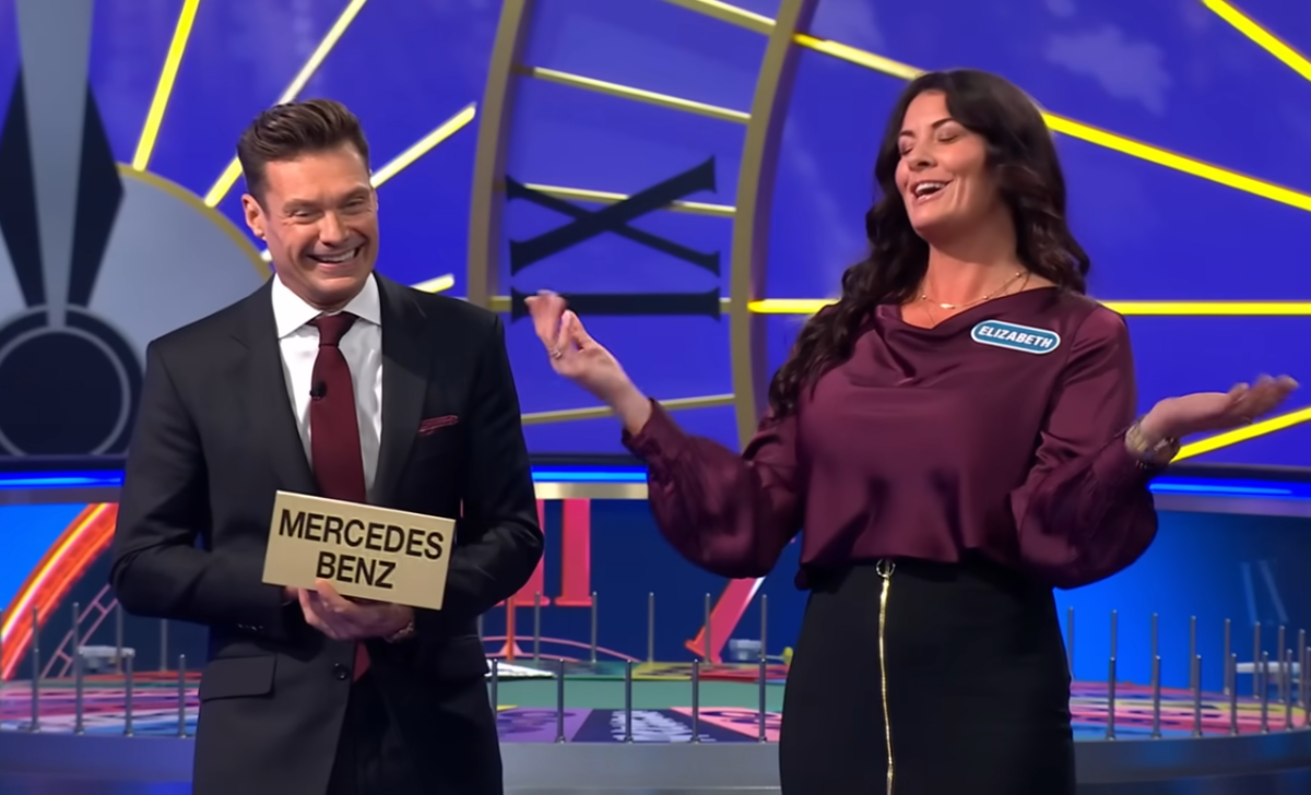 Show host Ryan Seacrest and contestant Elizabeth Caprini in a 'Wheel of Fortune' episode, Photo Credit: Wheel of Fortune/Youtube