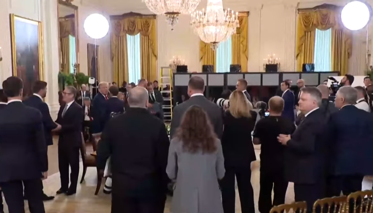 US President Donald Trump whispering to France President Emmanuel Macron during the meeting, Photo Credit: The Economic Times/Youtube