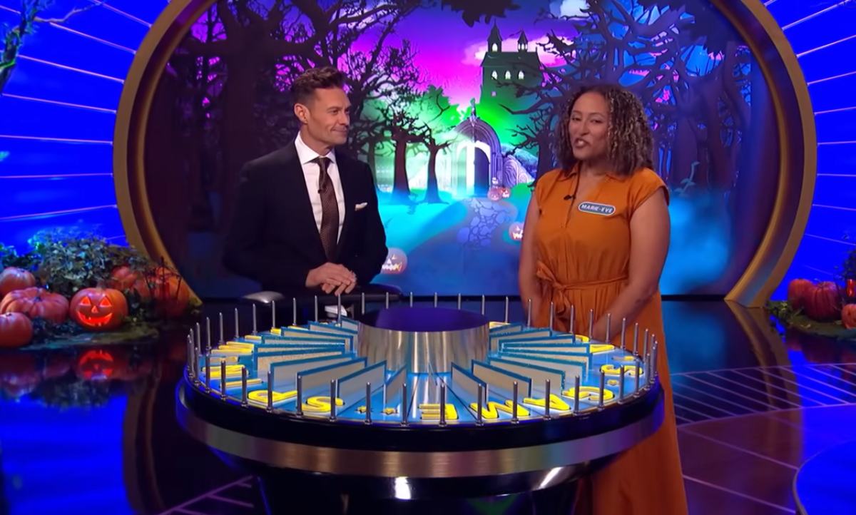 Show host Ryan Seacrest and contestant Marie-Eve Augier in a 'Wheel of Fortune' episode, Photo Credit: Wheel of Fortune/Youtube