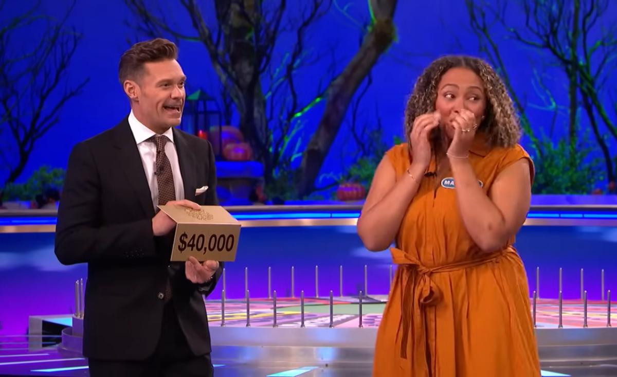 Show host Ryan Seacrest and contestant Marie-Eve Augier in a 'Wheel of Fortune' episode, Photo Credit: Wheel of Fortune/Youtube