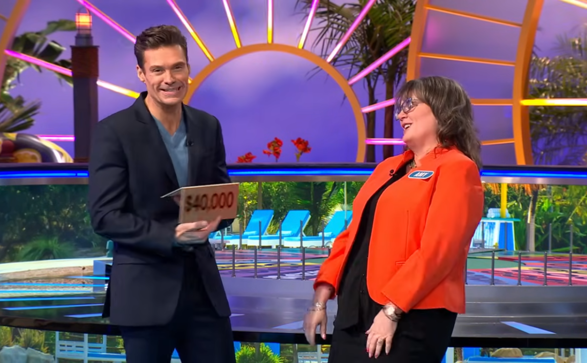Show host Ryan Seacrest and contestant Amy Johnston in a 'Wheel of Fortune' episode, Photo Credit: Wheel of Fortune/Youtube
