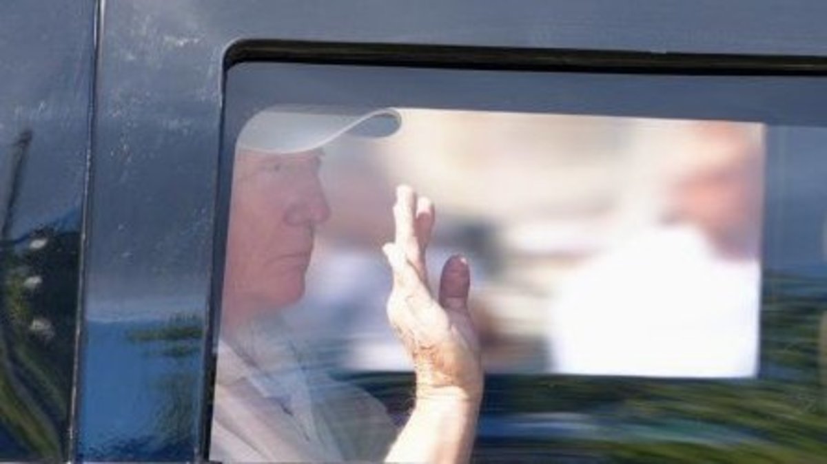 US President Donald Trump waving from inside of a car, Photo Credit: Globe Eye News/X