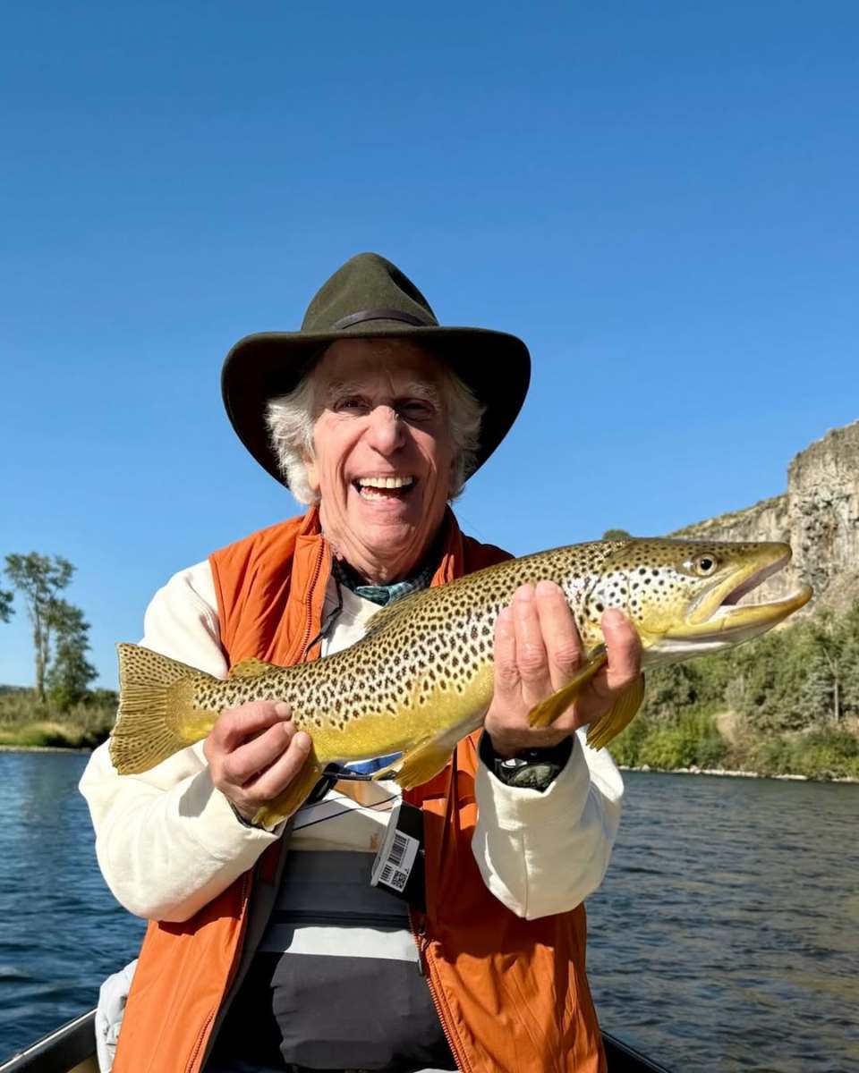 Henry Winkler holding a fish while smiling, Photo Credit: hwinkler4real/Instagram