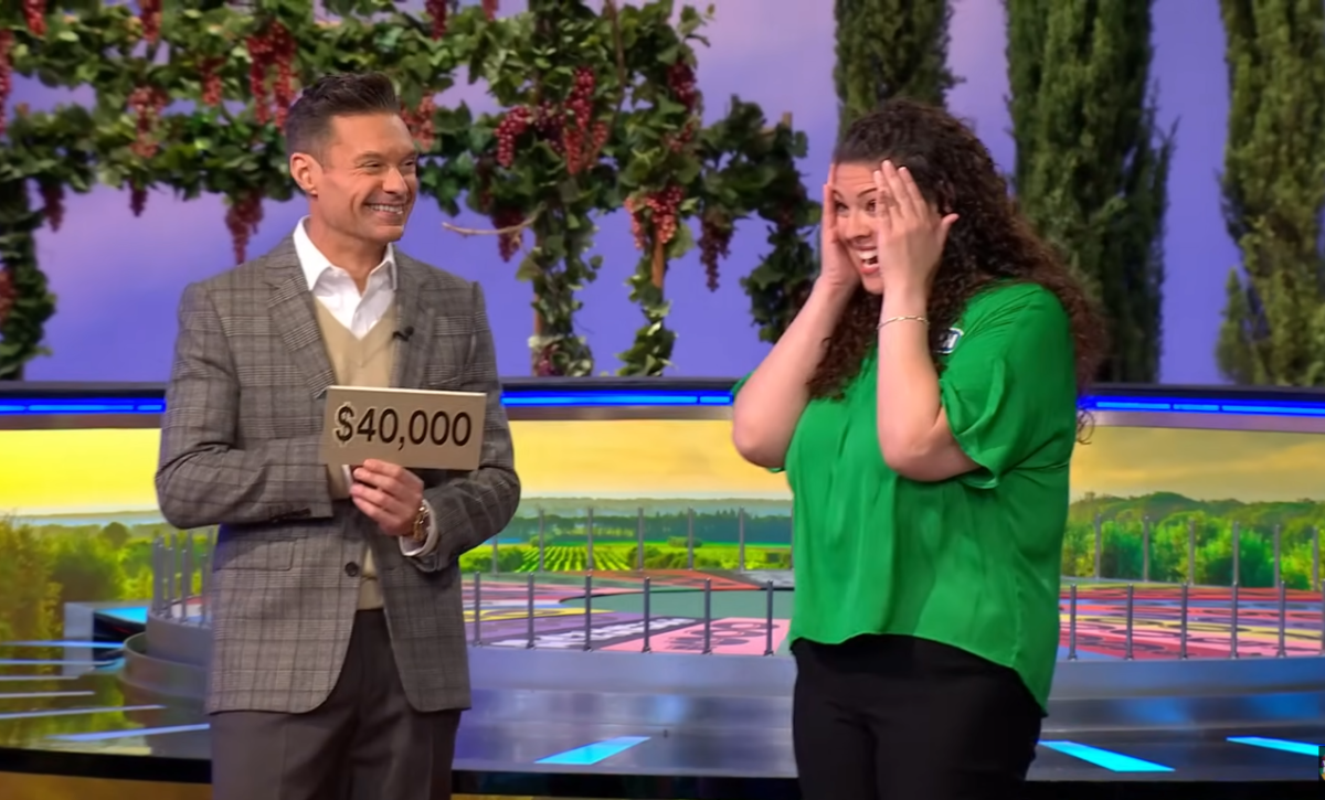 Show host Ryan Seacrest and contestant Megan Baldwin in a 'Wheel of Fortune' episode, Photo Credit: Wheel of Fortune/Youtube