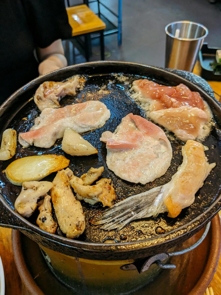 A pan filled with meat and vegetables on a stove, Photo Credit: Pexels