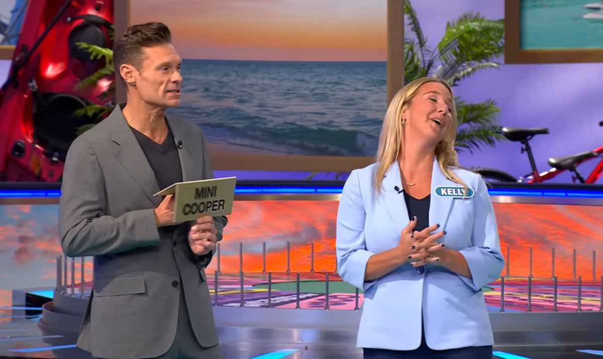 Show host Ryan Seacrest and contestant Kelly Amodio in a 'Wheel of Fortune' episode, Photo Credit: Wheel of Fortune/Youtube