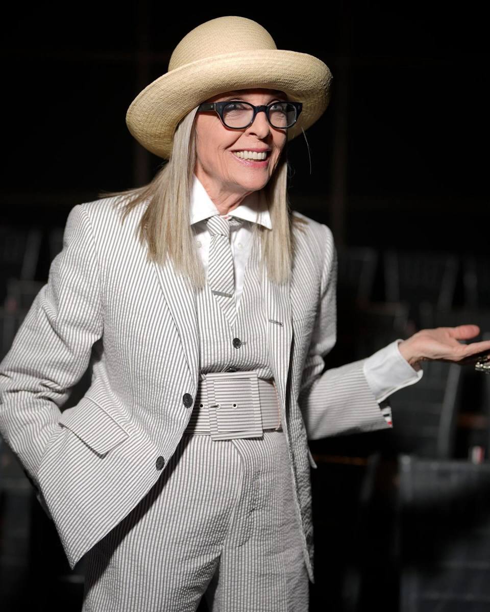 Diane Keaton wearing a white stripe suit and a light brown hat, Photo Credit: diane_keaton/Instagram