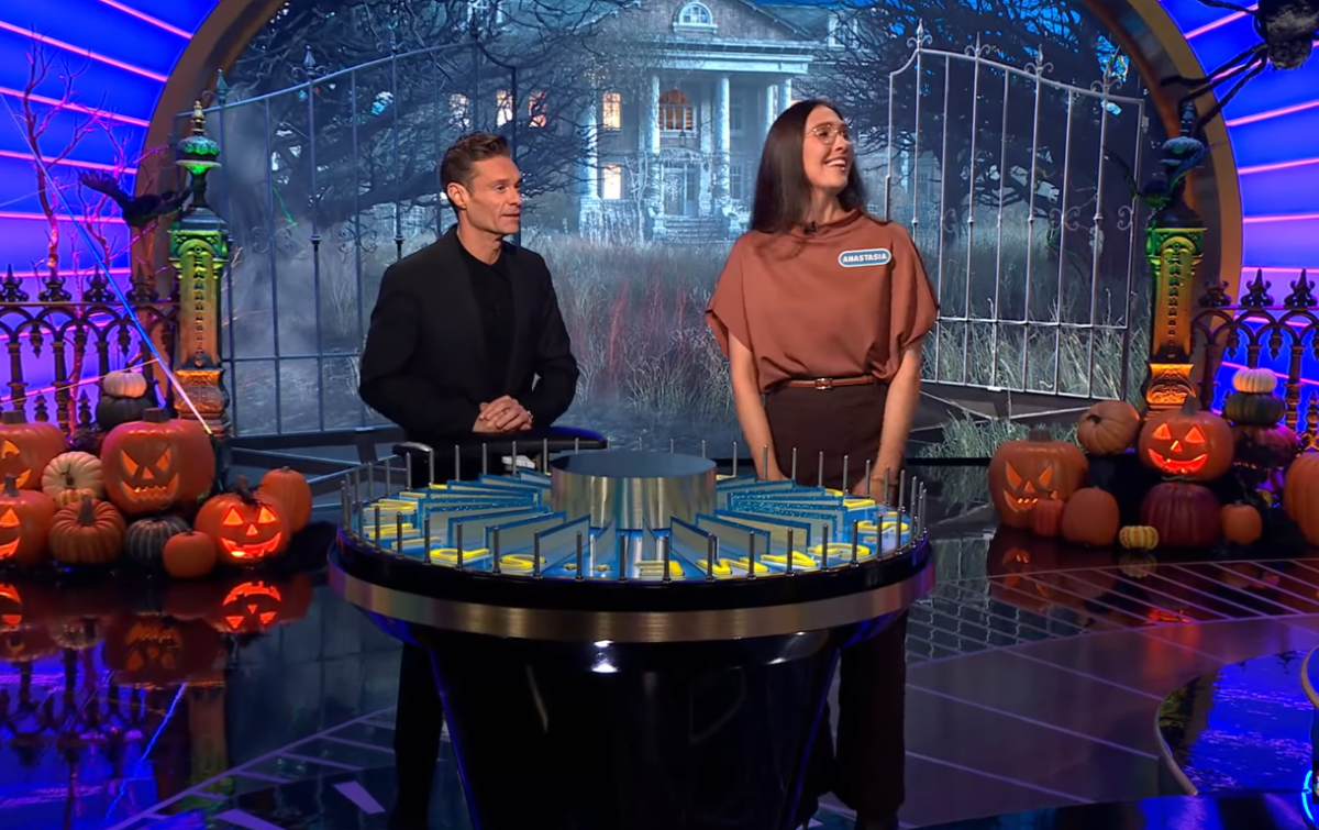 Show host Ryan Seacrest and contestant Anastasia Armitage in a 'Wheel of Fortune' episode, Photo Credit: Wheel of Fortune/Youtube