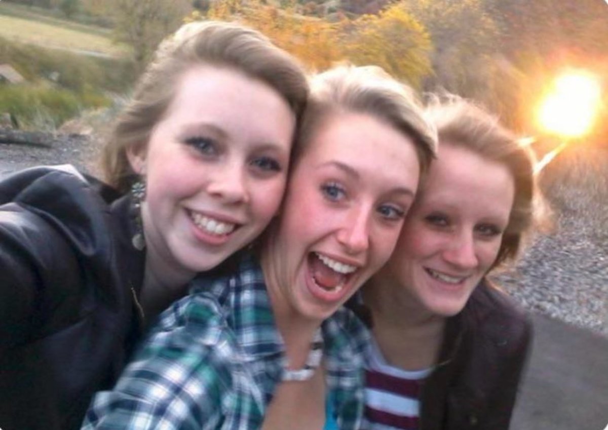 Selfie of Essa Ricker, Kelsea Webster, and Savannah Webster, seconds before they were hit and killed by the train in the background, Photo Credit: Creepy.org/X