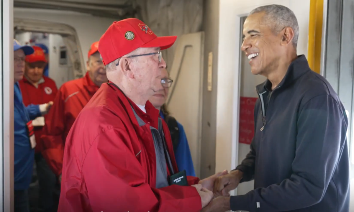 Former President Barack Obama surprising a flight of Korean and Vietnam War veterans on an honor flight, Photo Credit: Barack Obama/Youtube
