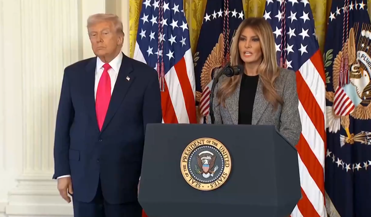 President Donald Trump standing beside his wife giving a speech, Photo Credit: Aaron Rupar/X