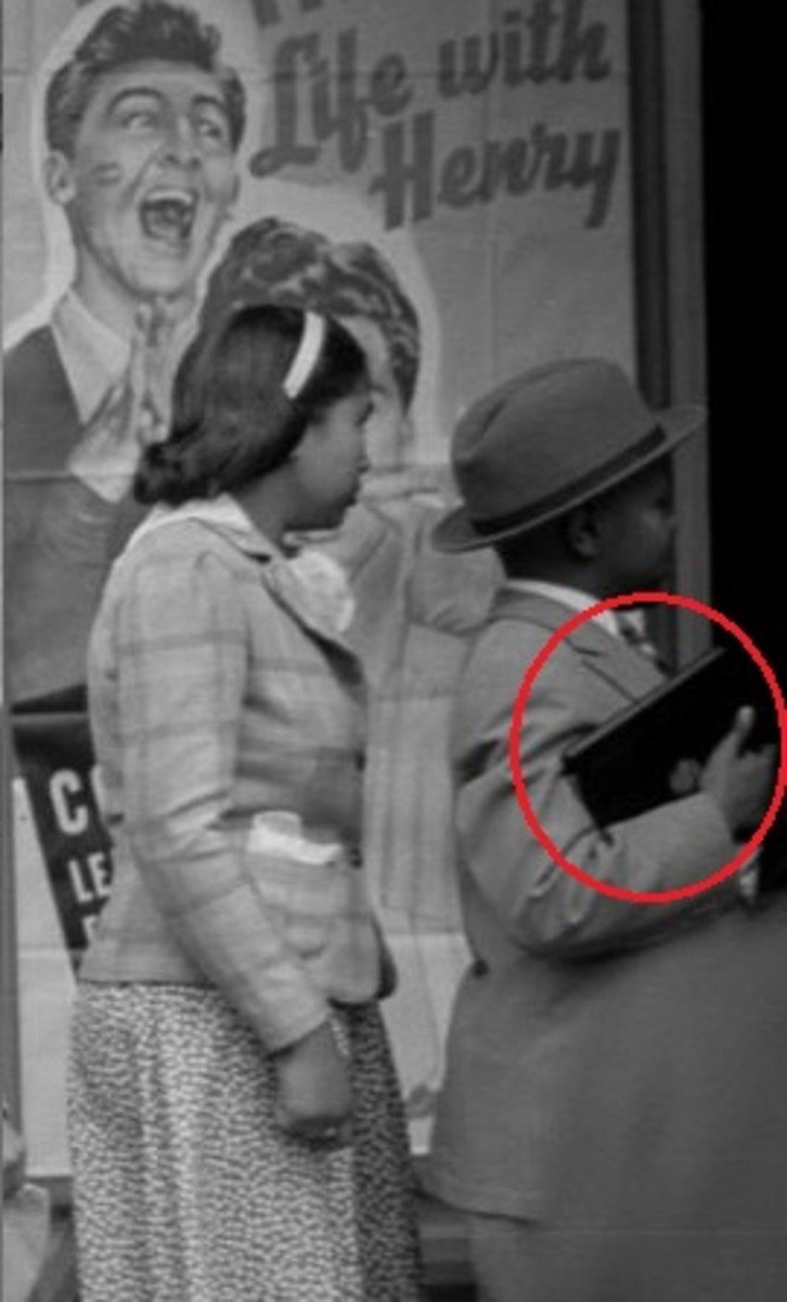 A boy holding what seems to be an iPad waiting in the movie line, Photo Credit: Reddit