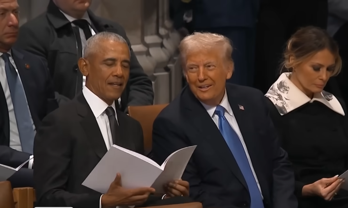 President Trump and President Obama smiling while talking to each other at Jimmy Carter's funeral, Photo Credit: Inside Edition/Youtube