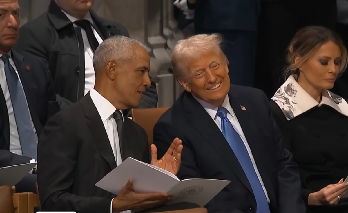 President Trump and President Obama smiling while talking to each other at Jimmy Carter's funeral, Photo Credit: Inside Edition/Youtube