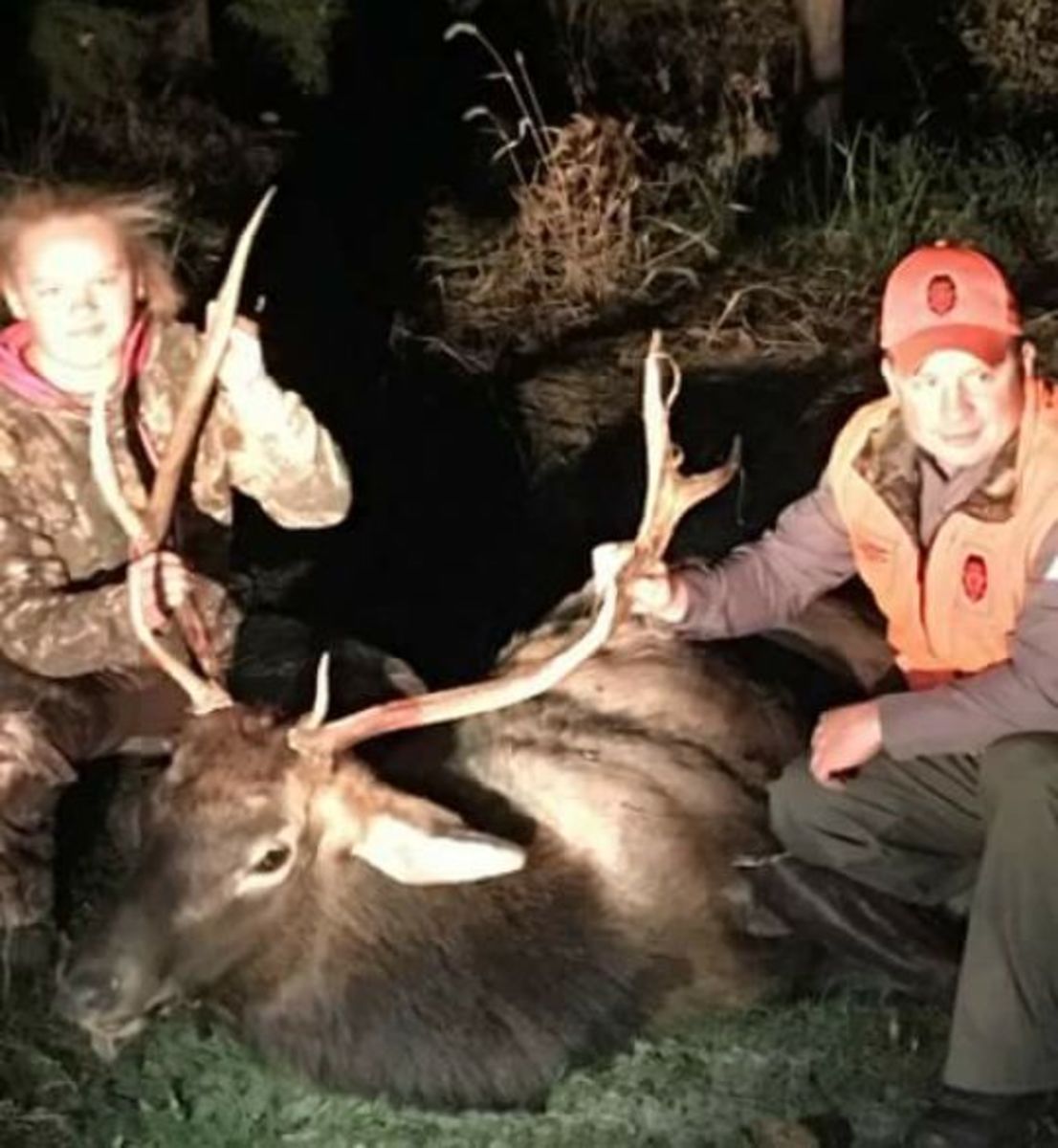 Abby Wilson and MDC agent Adam Doerhoff, after Abby accidentally shot this bull elk thinking it was a big white-tail buck, Photo Credit: Missouri Deer Hunter/Facebook