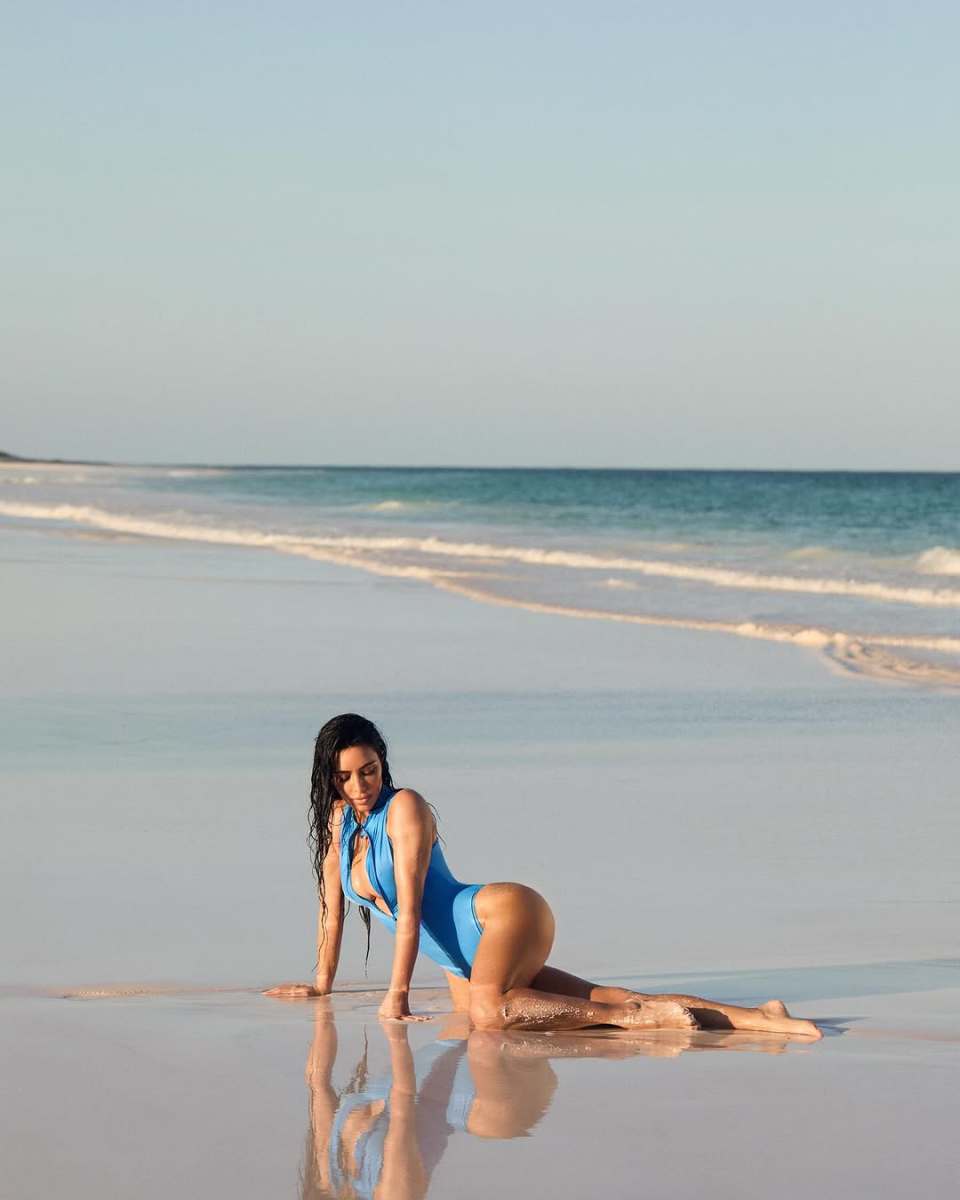 Kim Kardashian wearing new SKIMS bikini collection on the beach, Photo Credit: kimkardashian/Instagram