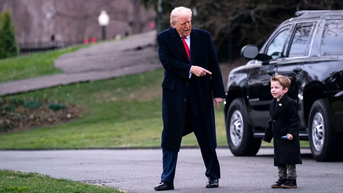 President Donald Trump with Elon Musk's son walking to Marine Force One, Photo Credit: mr bill/X
