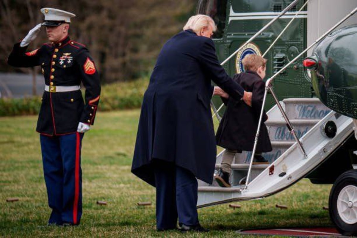 President Donald Trump lifting Lil X onto the steps of Marine Force One, Photo Credit: EvaMeva/X