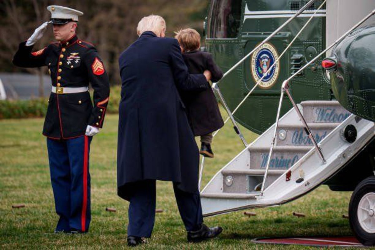 President Donald Trump lifting Lil X onto the steps of Marine Force One, Photo Credit: EvaMeva/X
