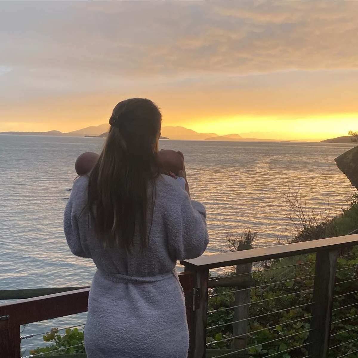 Hilary Swank holding her twins while watching the sunset, Photo Credit: hilaryswank/Instagram