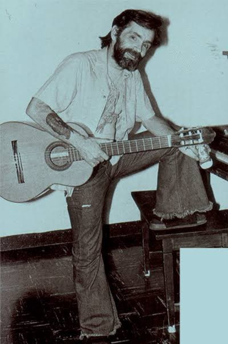 Charles Manson holding a guitar, Photo Credit: Paracetamol/X