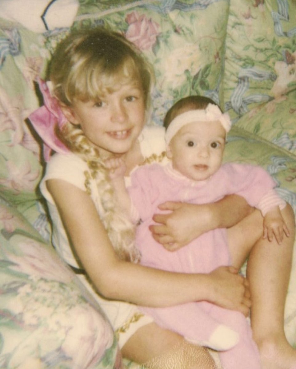 A young Paris Hilton holding her baby cousin, Photo Credit: parishilton/Instagram