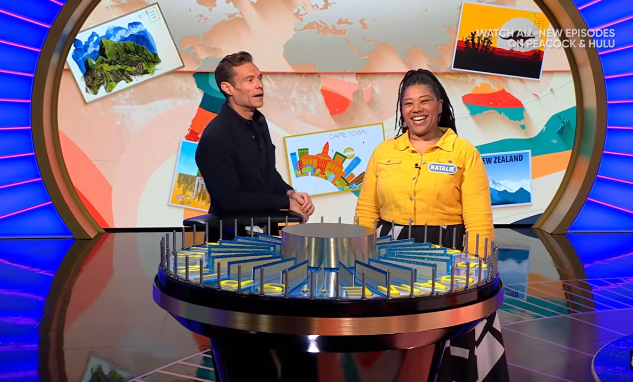 Show host Ryan Seacrest and contestant Natalie in a 'Wheel of Fortune' episode, Photo Credit: Wheel of Fortune/Youtube