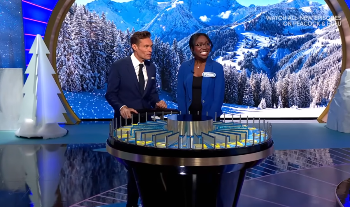 Show host Ryan Seacrest and contestant Vonda Ulfig in a 'Wheel of Fortune' episode, Photo Credit: Wheel of Fortune/Youtube