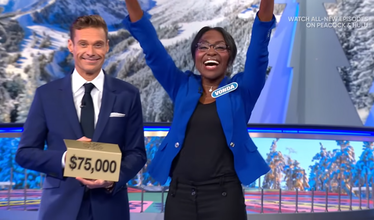Show host Ryan Seacrest and contestant Vonda Ulfig in a 'Wheel of Fortune' episode, Photo Credit: Wheel of Fortune/Youtube