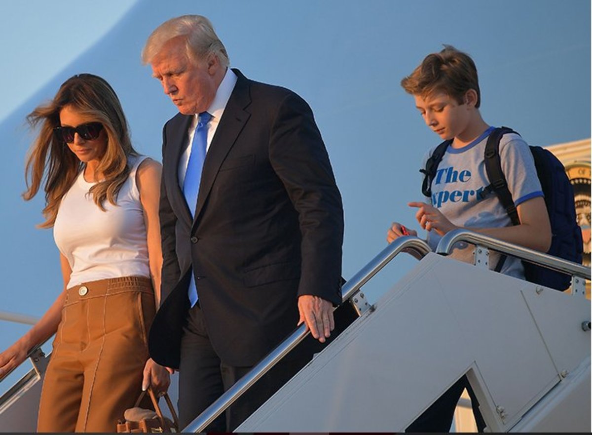  Young Barron Trump wearing his black backpack with his parents coming out of a plane, Photo Credit:  bongo5.com/X