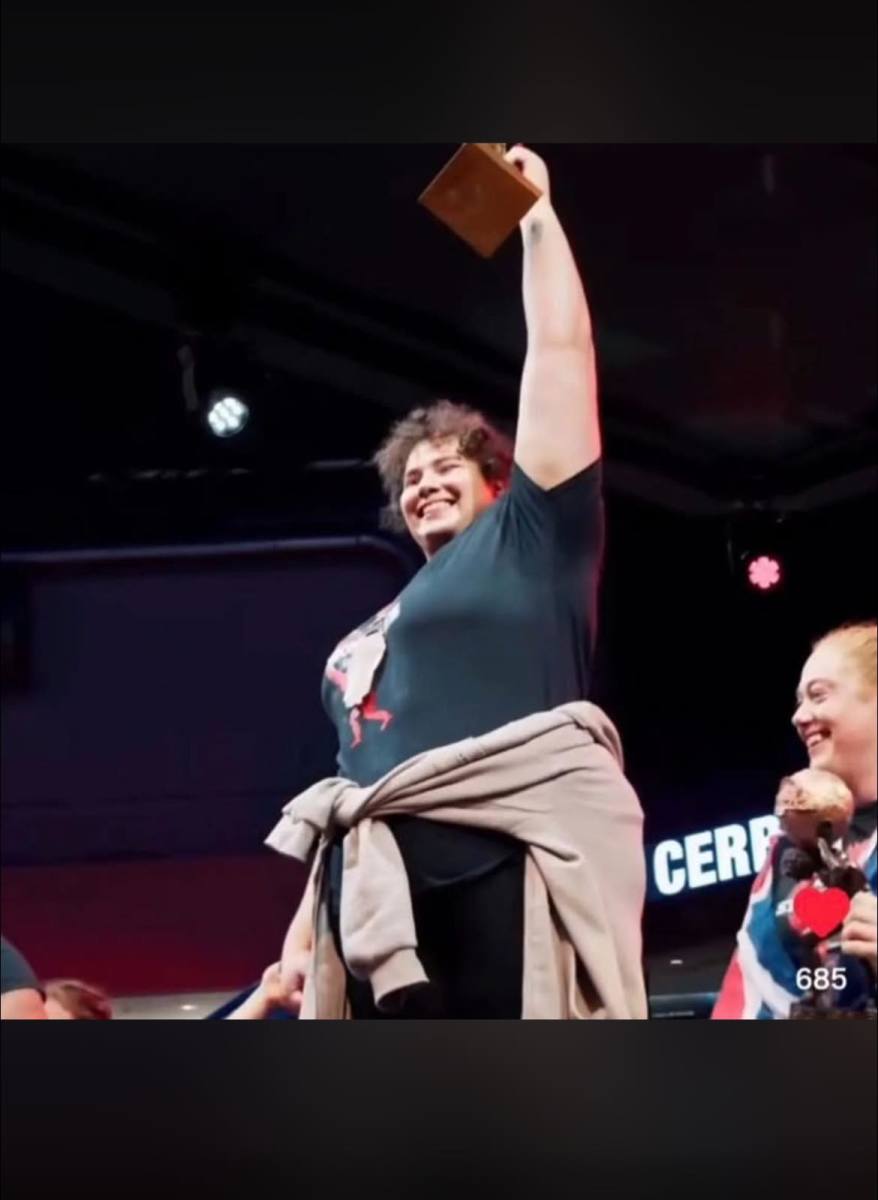 Jammie Booker holding up a trophy, Photo Credit: Christabel Shedrach/Facebook