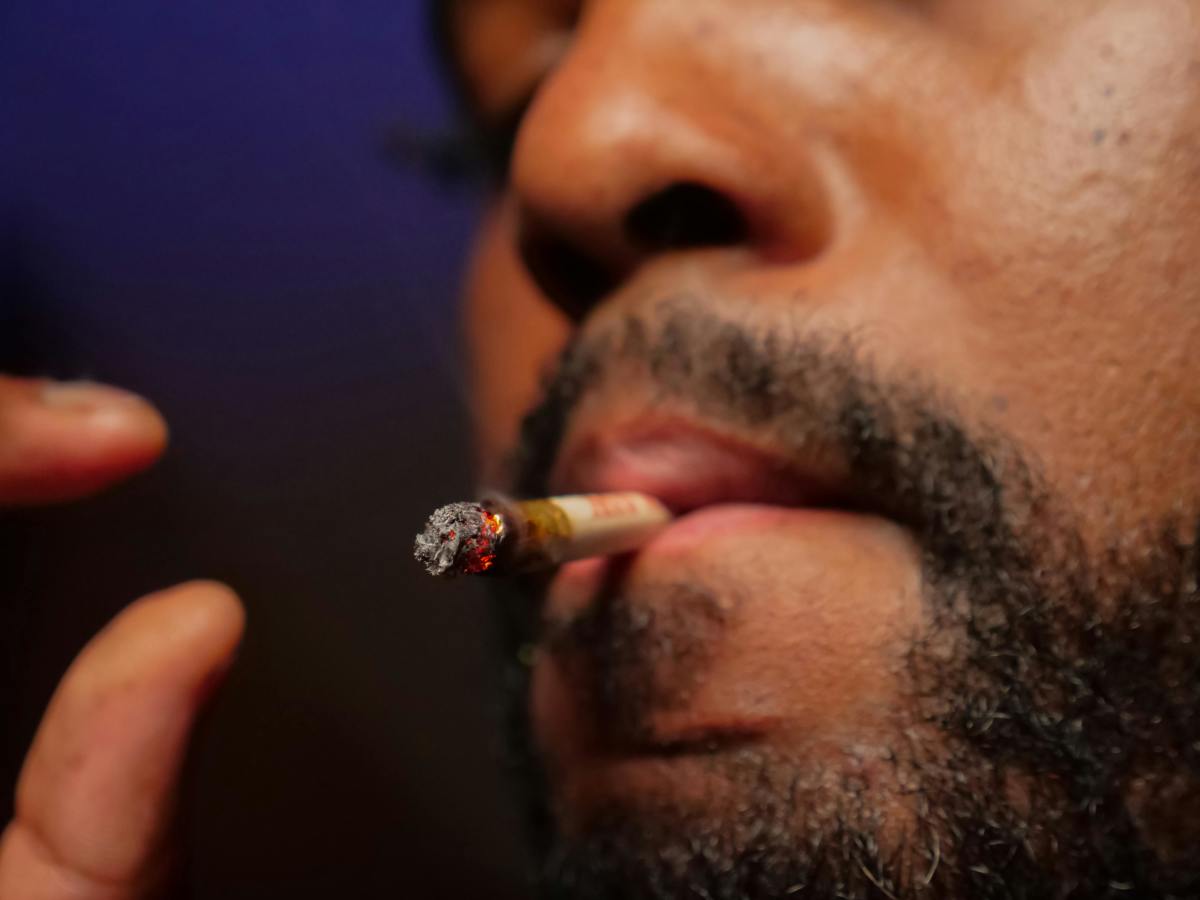 Close-Up Photo of Man Smoking Cannabis joint, Photo Credit: Pexels