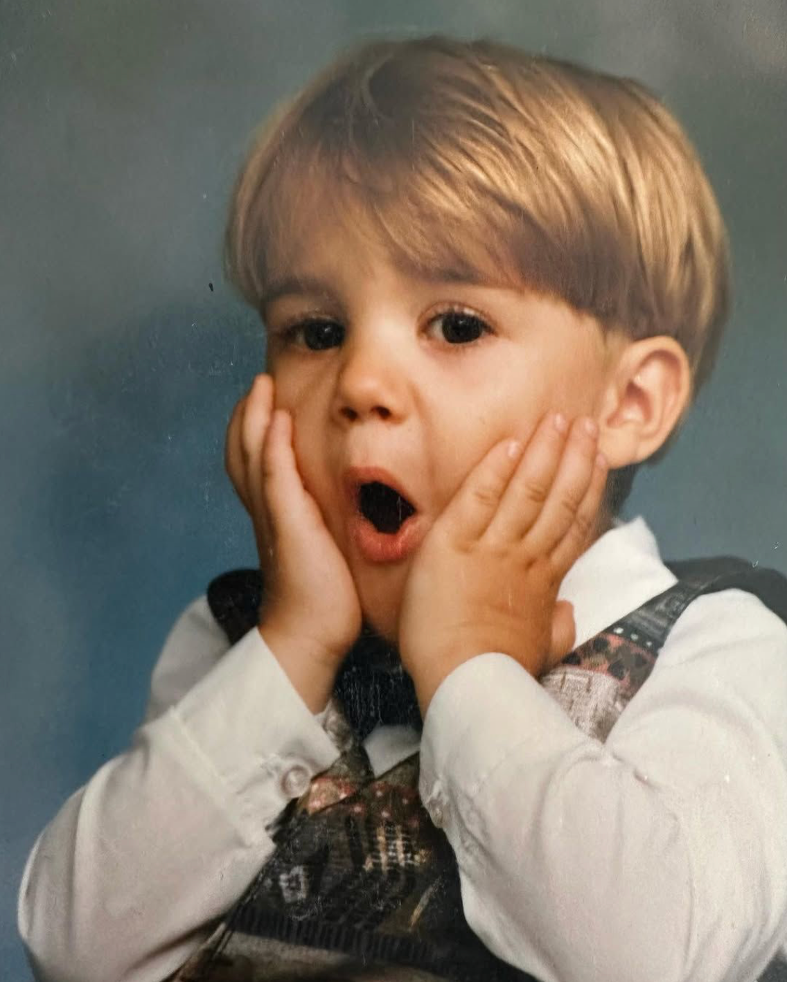 Photo of Justin Bieber when he was a little boy with his hands on his face posted to Pattie Mallette's instagram, Photo Credit: pattiemallette/Instagram