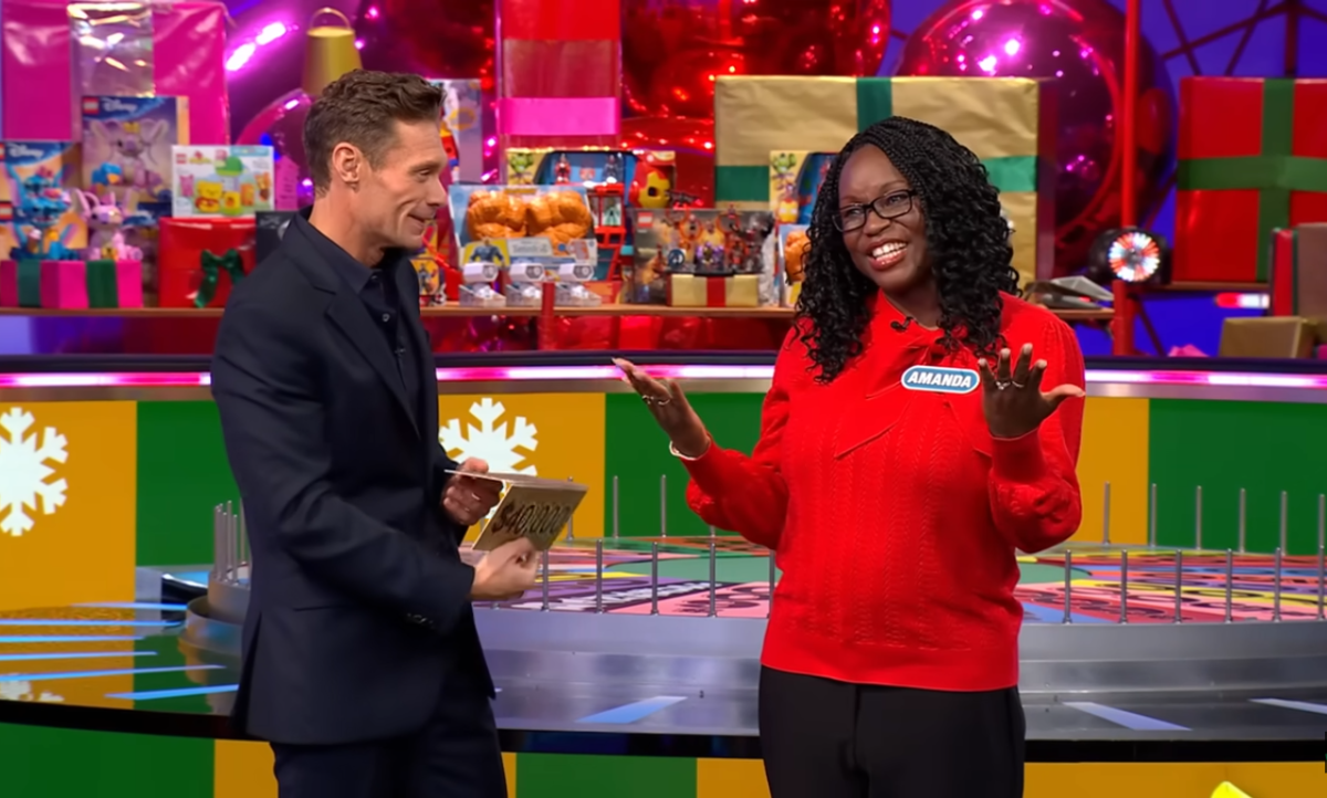 Show host Ryan Seacrest and contestant Amanda Brown in a 'Wheel of Fortune' episode, Photo Credit: Wheel of Fortune/Youtube