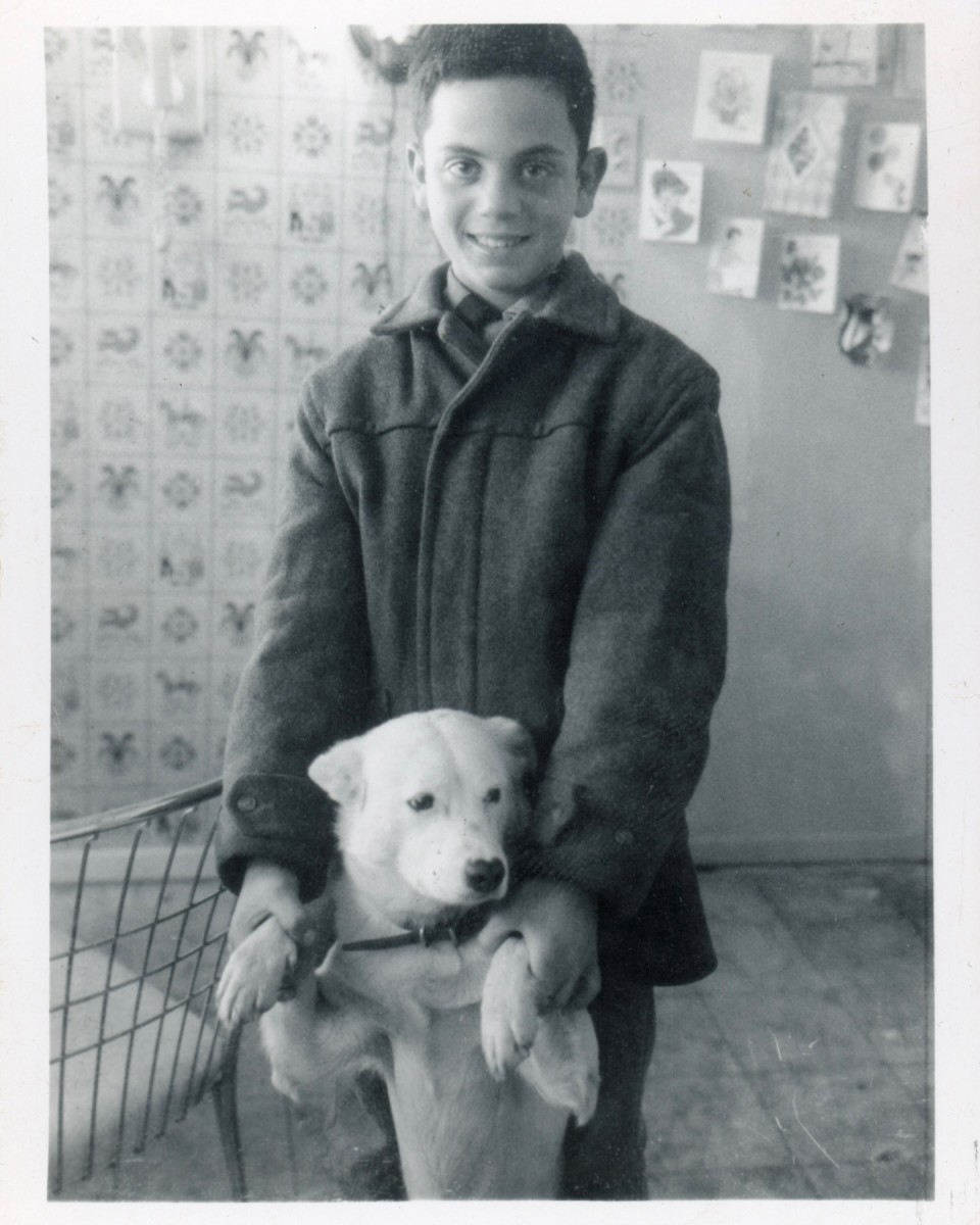A young Billy Joel posing with his dog, Photo Credit: Billy Joel/Facebook