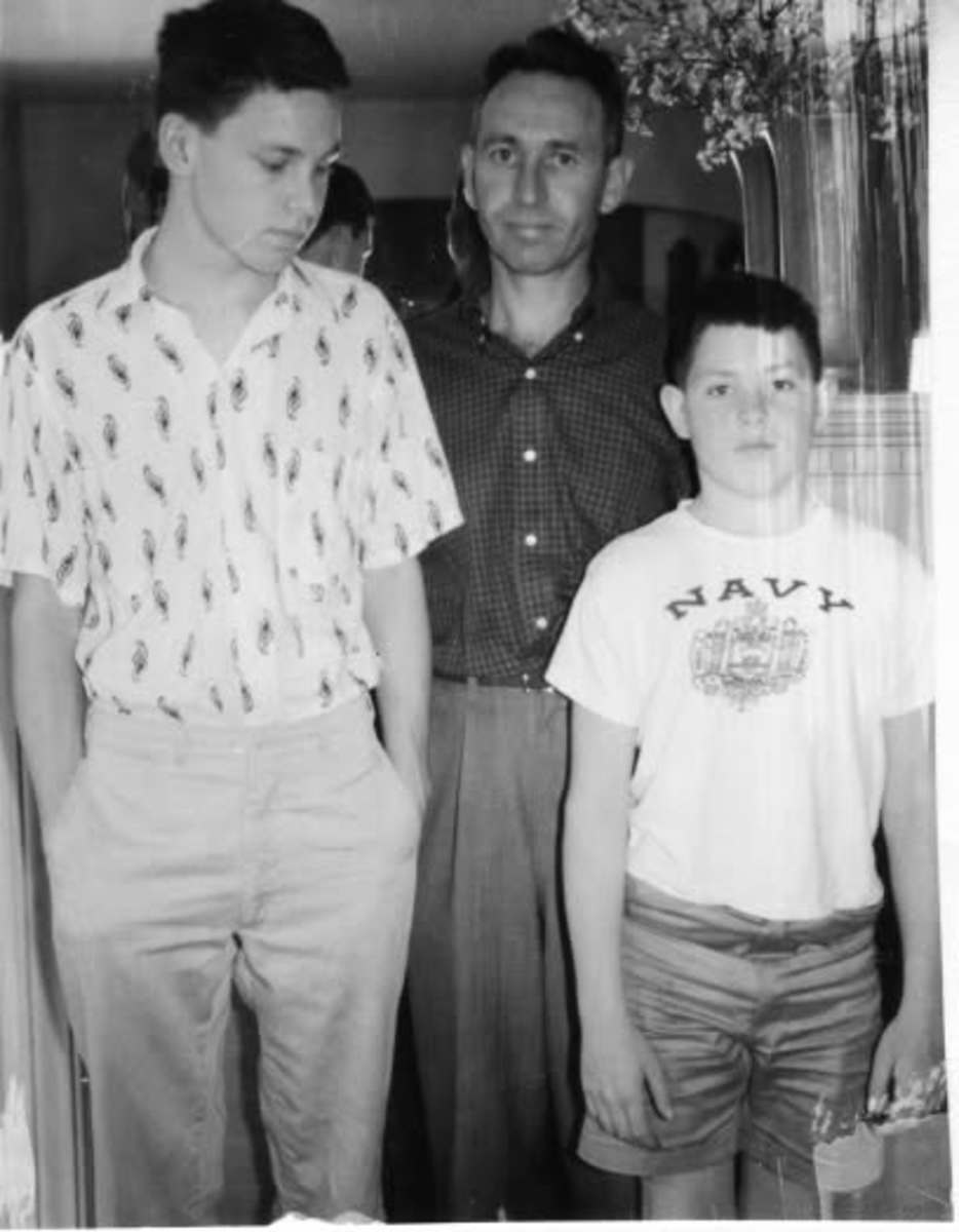 Jim Morrison posing with his father, Admiral George Stephen Morrison, and his younger brother, Andy, Photo Credit: Jim Morrison/Facebook